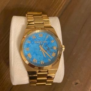 Stainless steel Michael Kors watch With torque turquoise face